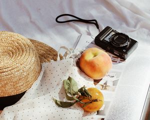 Preview wallpaper camera, peaches, fruit, magazine, fabric