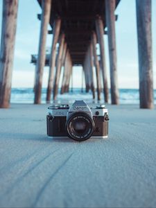 Preview wallpaper camera, pier, sand, blur