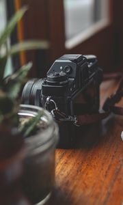 Preview wallpaper camera, plants, table, aesthetics