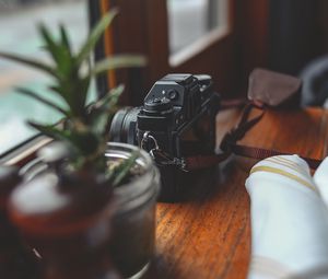 Preview wallpaper camera, plants, table, aesthetics