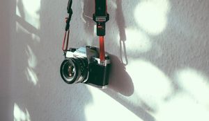 Preview wallpaper camera, strap, wall, shadow