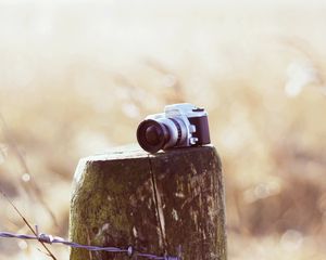 Preview wallpaper camera, stump, wire, grass, field