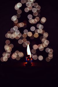 Preview wallpaper candle, fire, darkness, glare, bokeh