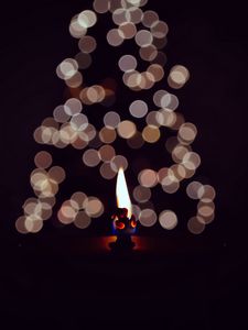 Preview wallpaper candle, fire, darkness, glare, bokeh