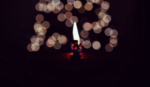 Preview wallpaper candle, fire, darkness, glare, bokeh