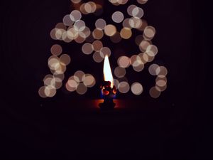 Preview wallpaper candle, fire, darkness, glare, bokeh