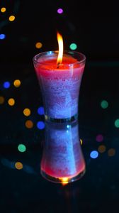 Preview wallpaper candle, fire, light, bokeh, colorful, dark