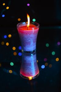 Preview wallpaper candle, fire, light, bokeh, colorful, dark