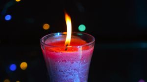 Preview wallpaper candle, fire, light, bokeh, colorful, dark
