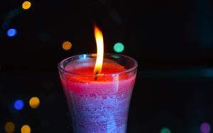 Preview wallpaper candle, fire, light, bokeh, colorful, dark