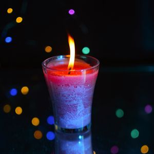 Preview wallpaper candle, fire, light, bokeh, colorful, dark