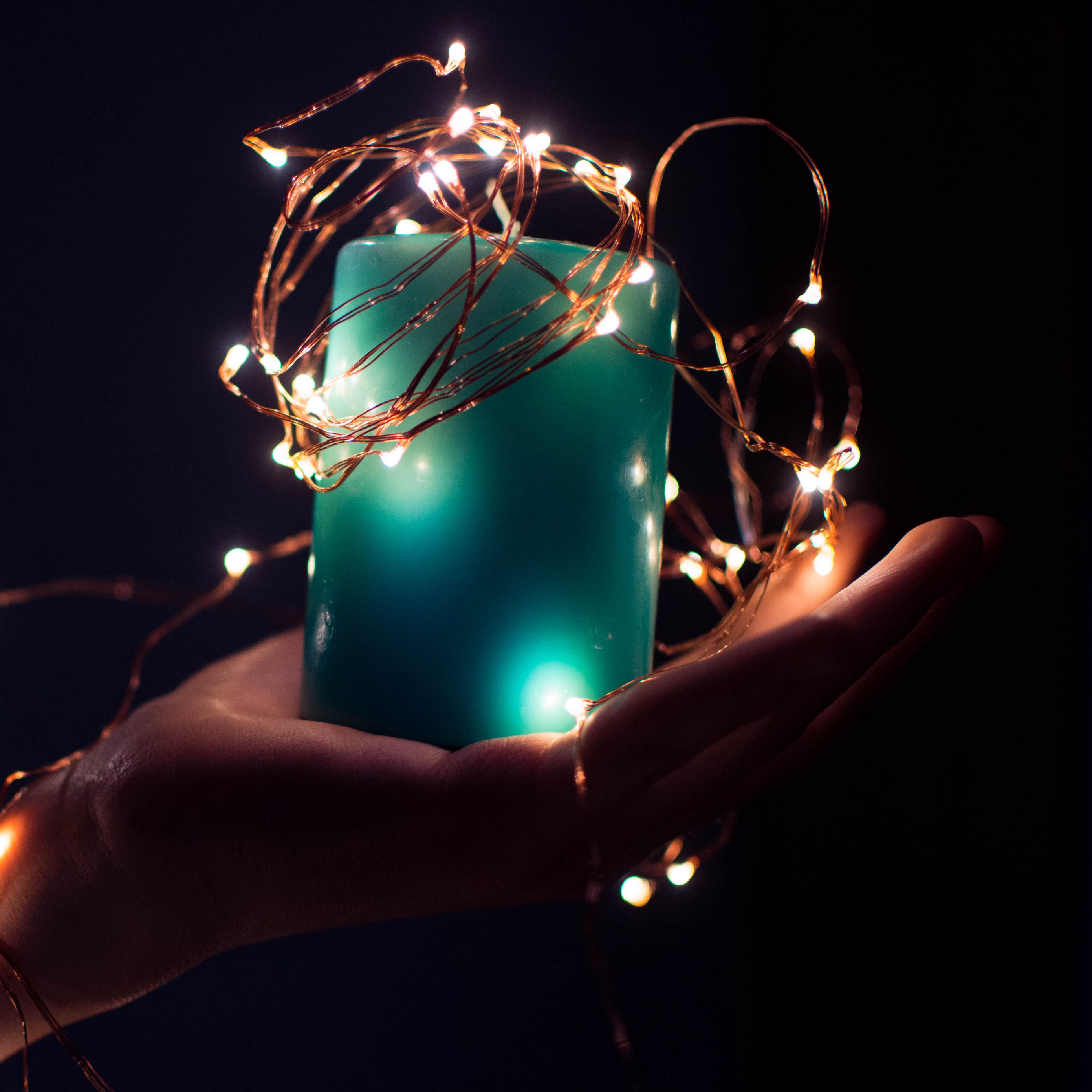 Download wallpaper 2780x2780 candle, hand, garland ipad air, ipad air 2