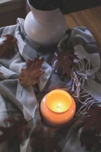 Preview wallpaper candle, leaves, autumn, fabric, flame
