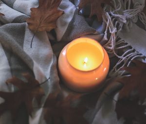 Preview wallpaper candle, leaves, autumn, fabric, flame