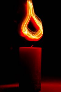 Preview wallpaper candle, light, long exposure, red