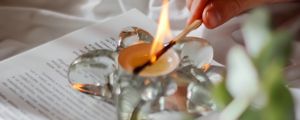 Preview wallpaper candle, match, hand, book, branch
