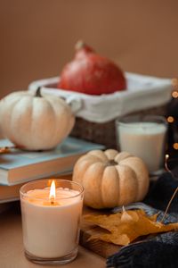 Preview wallpaper candle, pumpkin, leaf, books