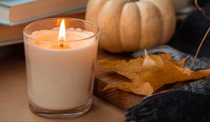 Preview wallpaper candle, pumpkin, leaf, books