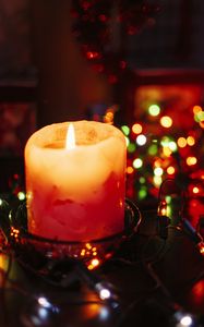 Preview wallpaper candle, wax, wick, garland, glare, bokeh