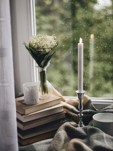 Preview wallpaper candle, window, bouquet, rain, books, plaid, cup