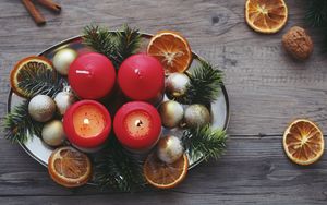 Preview wallpaper candles, christmas, spruce, oranges