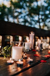 Preview wallpaper candles, glass, petals, table