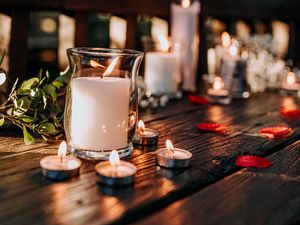 Preview wallpaper candles, glass, petals, table