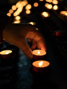 Preview wallpaper candles, hand, dark