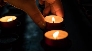 Preview wallpaper candles, hand, dark