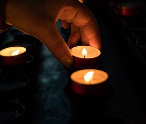 Preview wallpaper candles, hand, dark