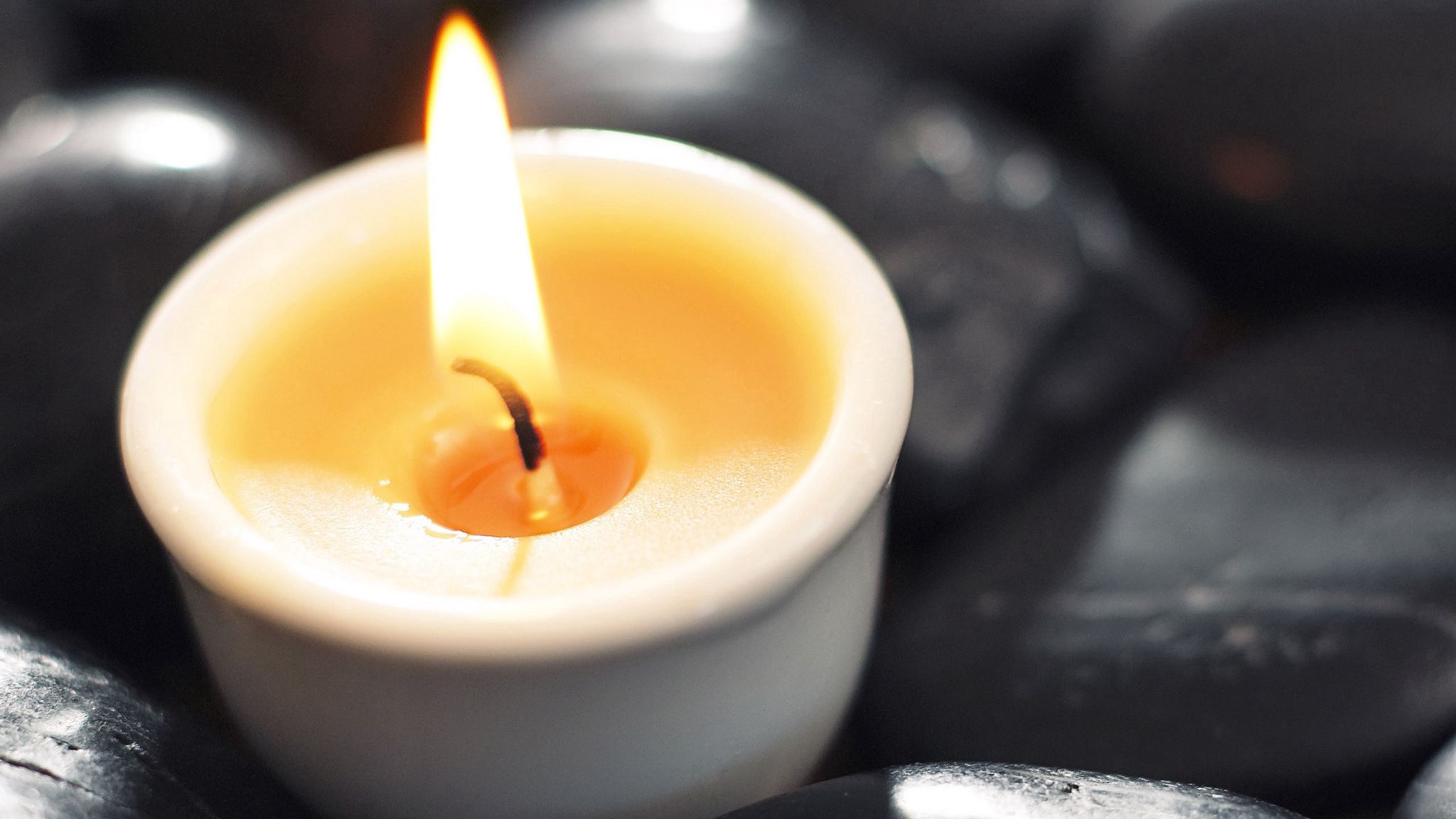 Download wallpaper 2048x1152 candlestick, candle, flame, stone ...