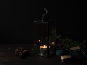 Preview wallpaper candlestick, candle, gifts, dark