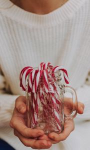 Preview wallpaper candy canes, candy, jar, hands