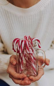 Preview wallpaper candy canes, candy, jar, hands