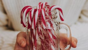 Preview wallpaper candy canes, candy, jar, hands