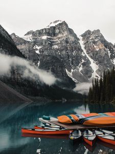Preview wallpaper canoe, boats, lake, pier, mountains