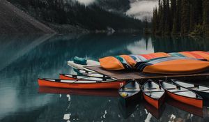 Preview wallpaper canoe, boats, lake, pier, mountains