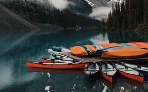 Preview wallpaper canoe, boats, lake, pier, mountains