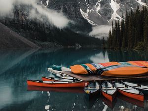 Preview wallpaper canoe, boats, lake, pier, mountains