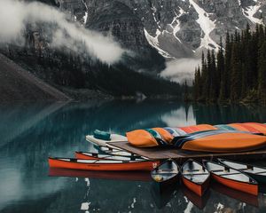 Preview wallpaper canoe, boats, lake, pier, mountains