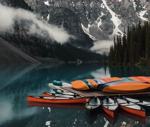 Preview wallpaper canoe, boats, lake, pier, mountains