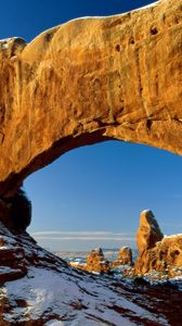 Preview wallpaper canyon, arch, window, snow, stones, mountains