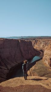 Preview wallpaper canyon, man, cliff, river, view