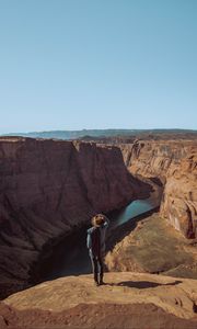 Preview wallpaper canyon, man, cliff, river, view