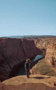 Preview wallpaper canyon, man, cliff, river, view