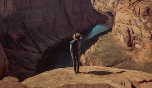 Preview wallpaper canyon, man, cliff, river, view