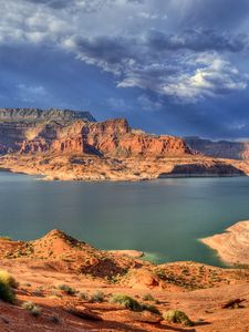 Preview wallpaper canyons, lake, bushes, mountains, clouds, sky, gray, cloudy, light