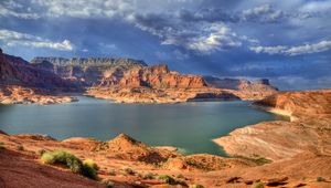 Preview wallpaper canyons, lake, bushes, mountains, clouds, sky, gray, cloudy, light