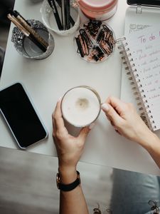 Preview wallpaper cappuccino, mug, hands, table, work, aesthetics