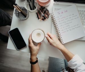 Preview wallpaper cappuccino, mug, hands, table, work, aesthetics